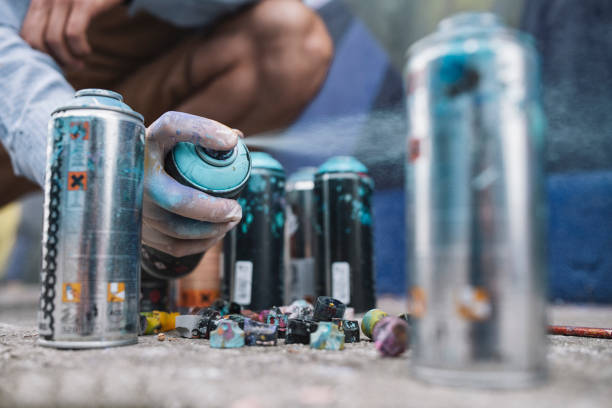 Graffiti Artist's Hand Reaching For Spray Bottle